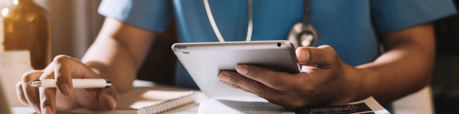 holding a tablet computer