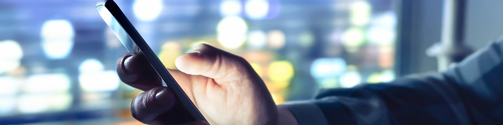 holding a mobile phone